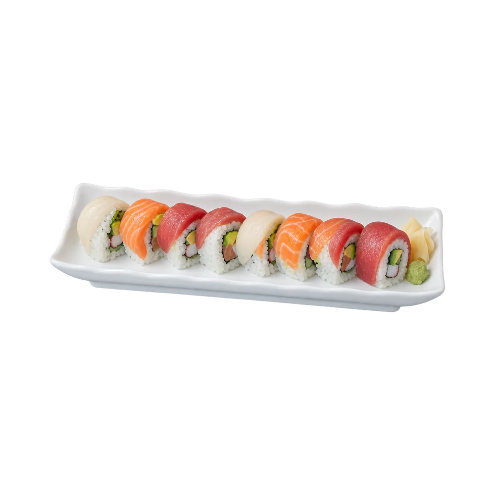 Rainbow roll topped with tuna, salmon, yellowtail and white fish on a long white plate