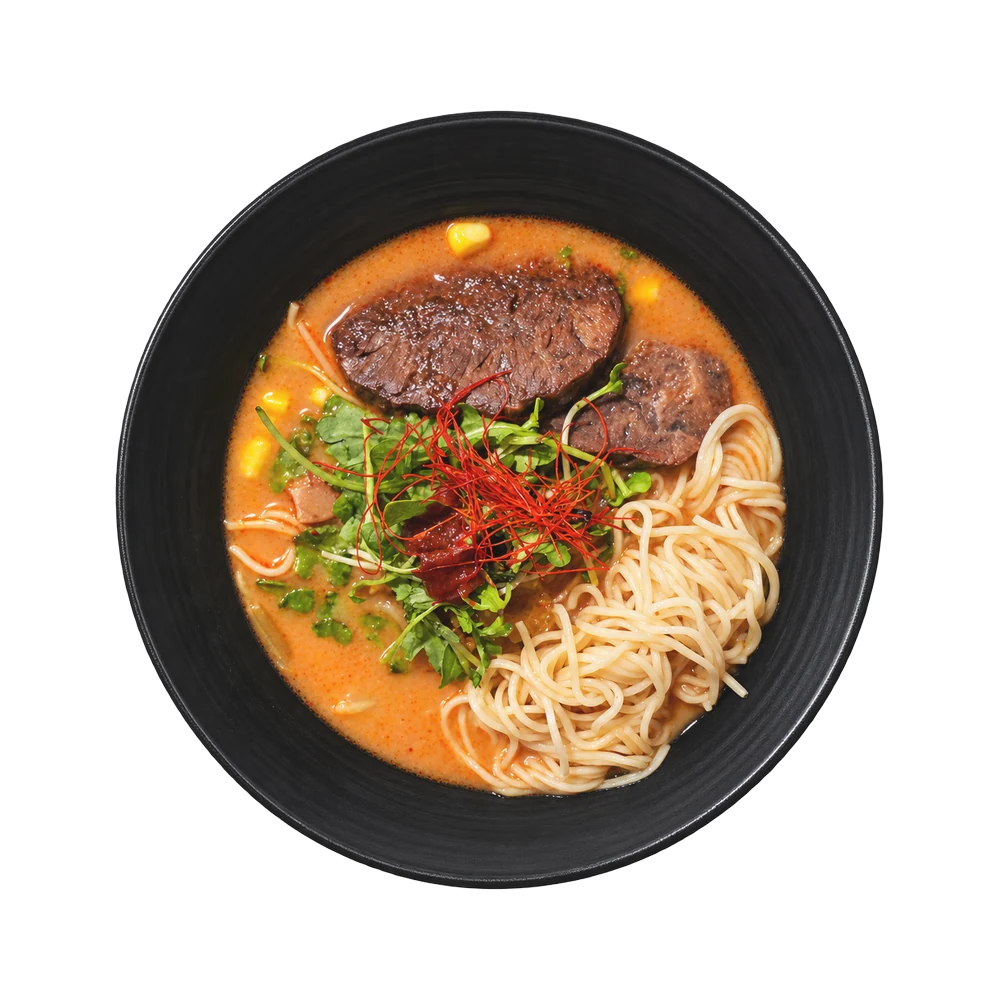 Spicy beef ramen with roasted chashu beef, arugula and shredded red pepper