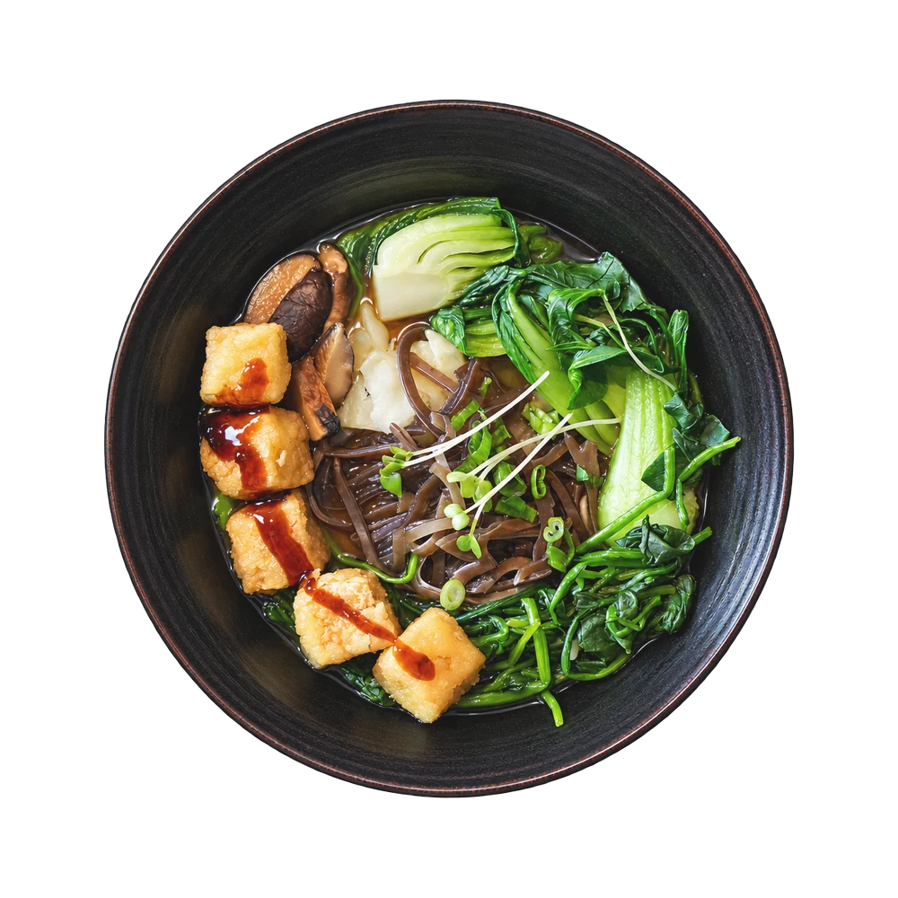 Vegetables ramen with glazed tofu, shiitake, bok choy and spinach in a black bowl