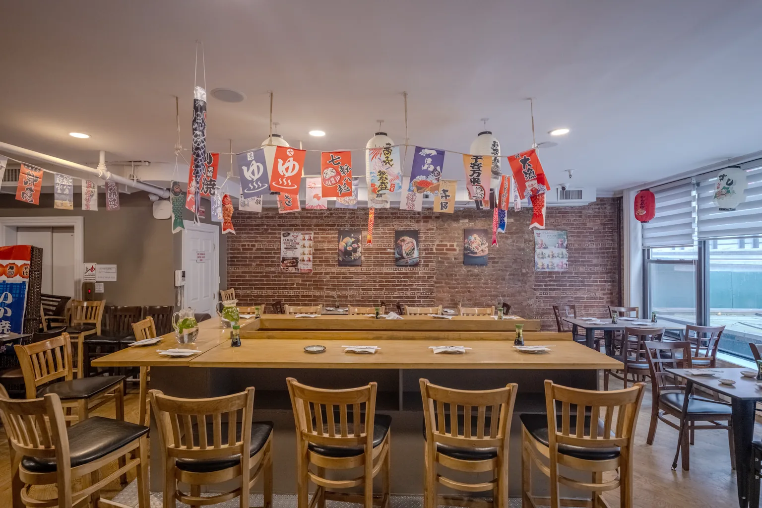 A long communal table set for a group in the Zen dining room